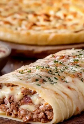 Roladki pizzowe z mięsem i serem – pyszna przekąska w 30 minut